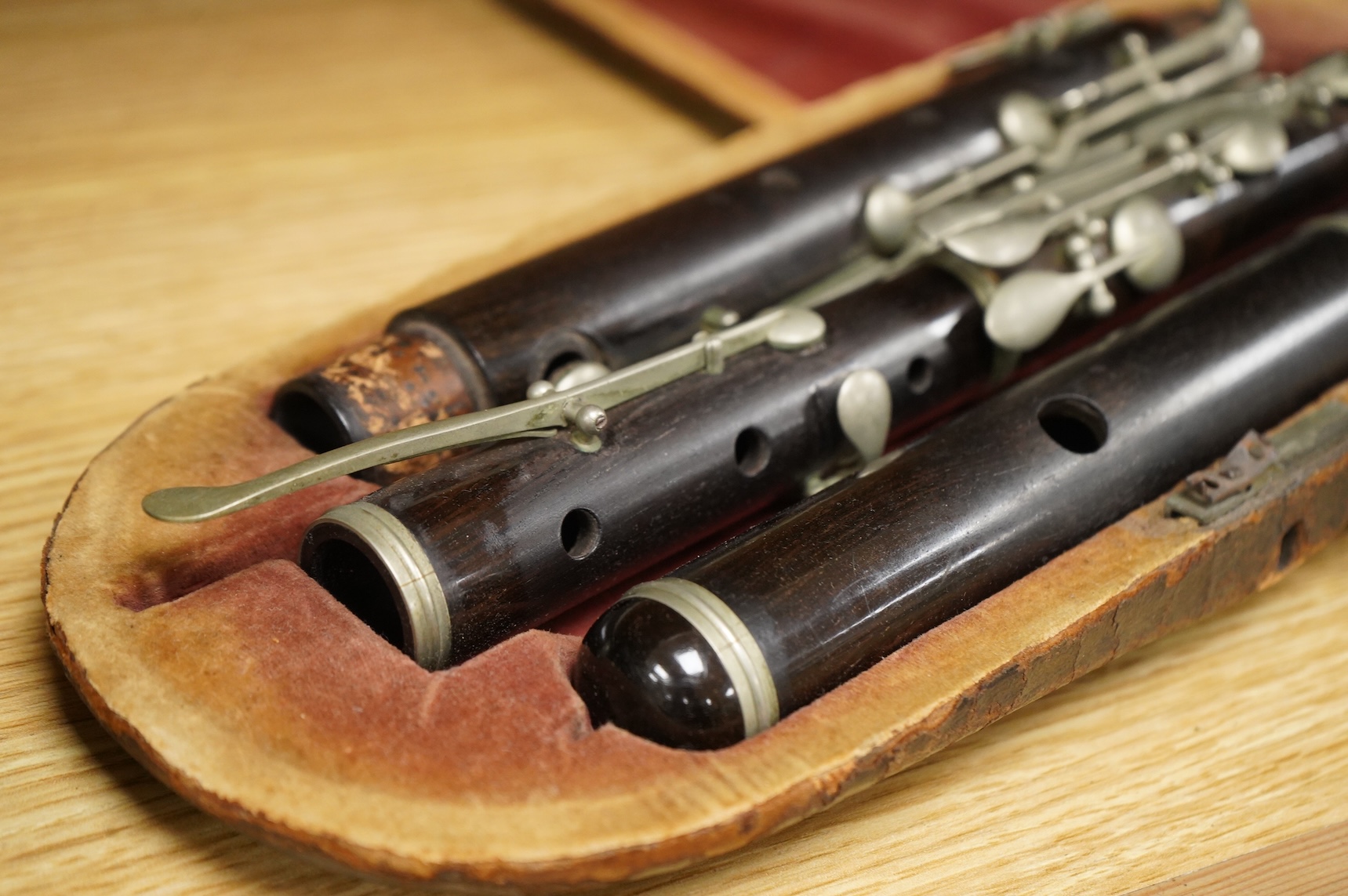 A 19th century cased ebony flute, with ten key system, unsigned, the case af